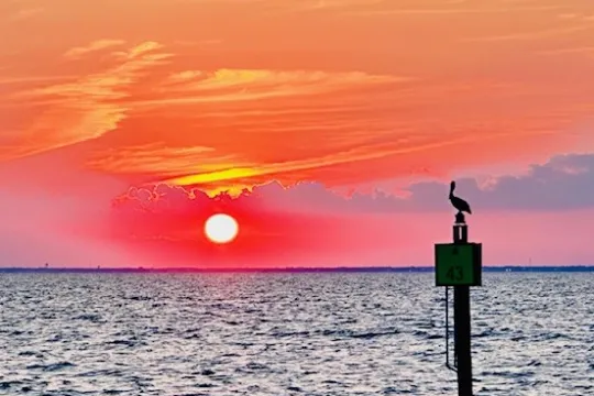 a sunset over a body of water