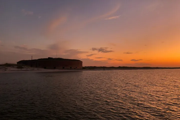 a sunset over a body of water