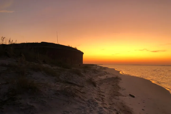 a sunset over a body of water